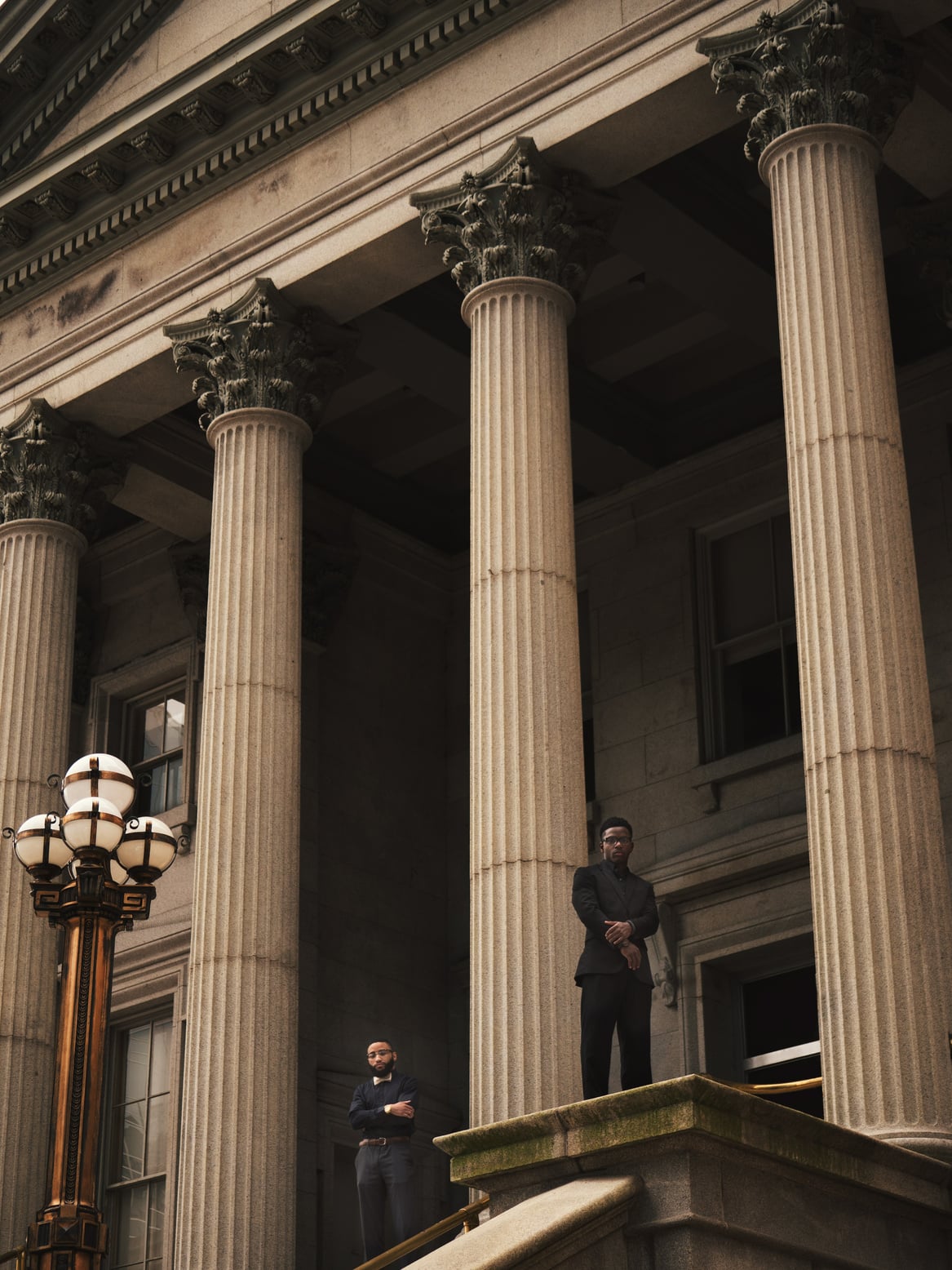 Two Man Posing Outside a Courthouse